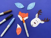 Coloured pens colouring paper animal faces