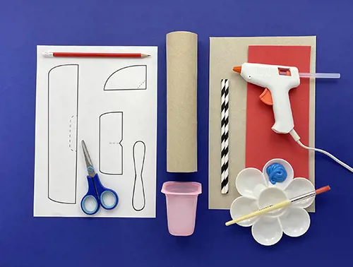 Paper tube, straws, paint and brushes, scissors, cardboard, glue gun, yoghurt pot, foam sheet, and a printable pattern.