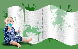 Yoghurt-covered baby in mucky blue outfit sits next to giant graphic visual of Plenty Flexisheet kitchen paper.