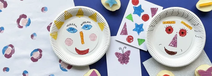 Potato printed red hearts on white paper